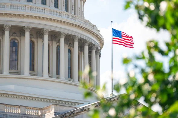 Close-up view of the American Flag on the U.S. Capitol building