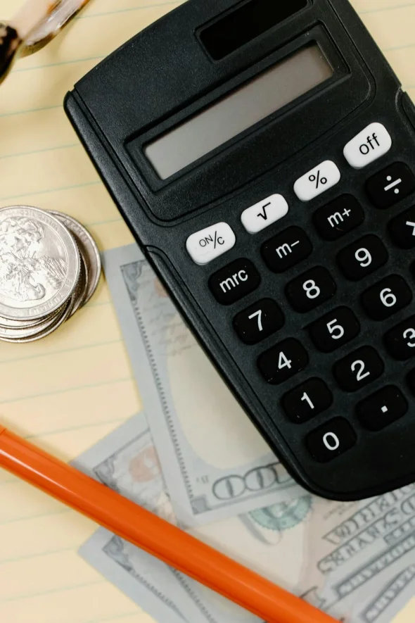 A black calculator for divorce costs in New York.